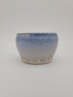 Small rounded bowl with blue glaze detail