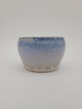 Small rounded bowl with blue glaze detail