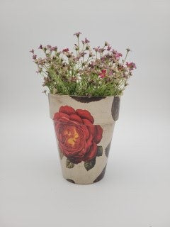 Decoupaged pot with various designs