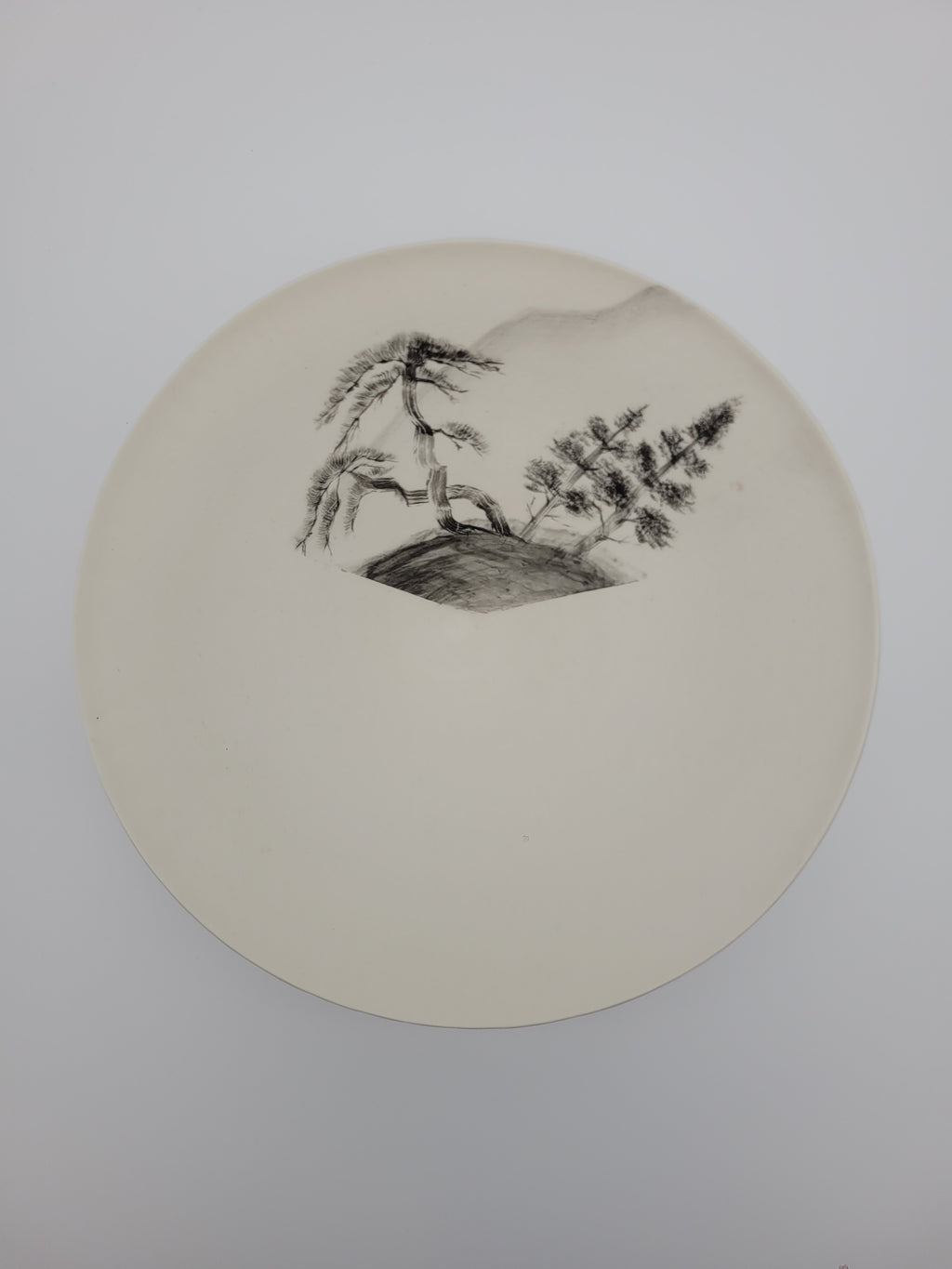 White ceramic bowl with hand painted tree design