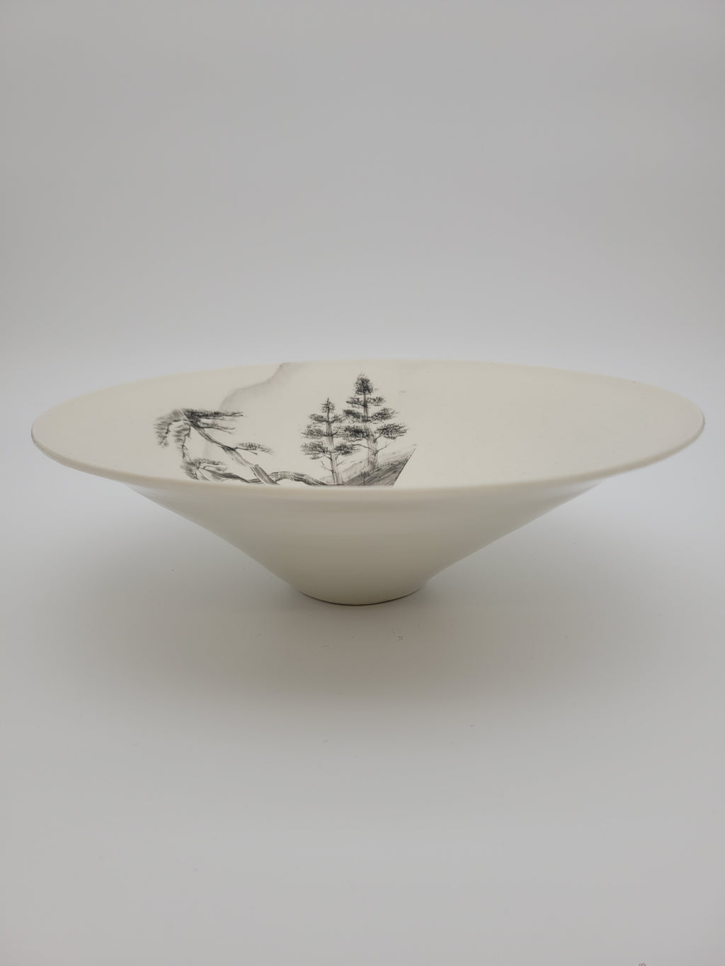 White ceramic bowl with hand painted tree design