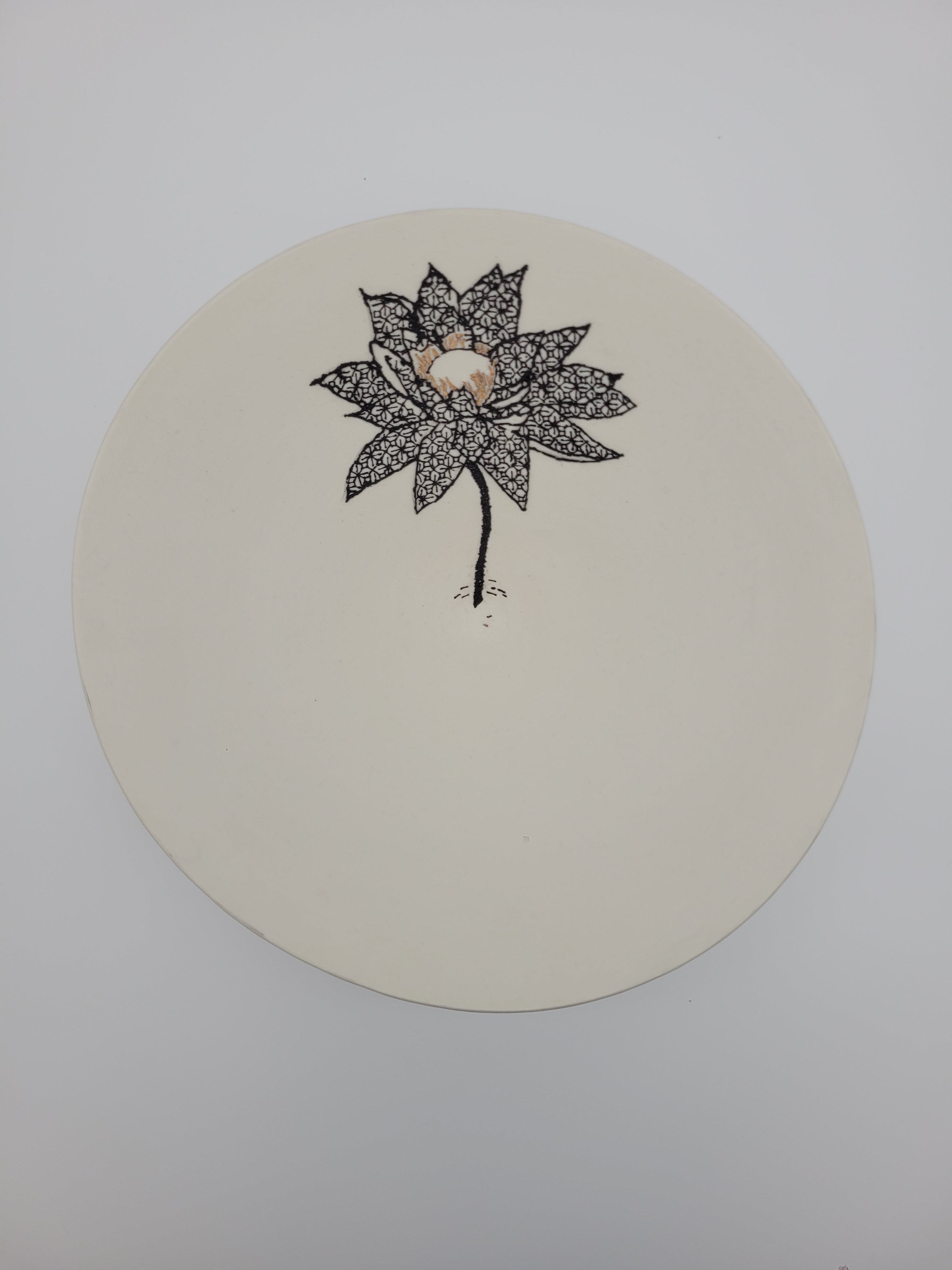 White ceramic bowl with black floral detail