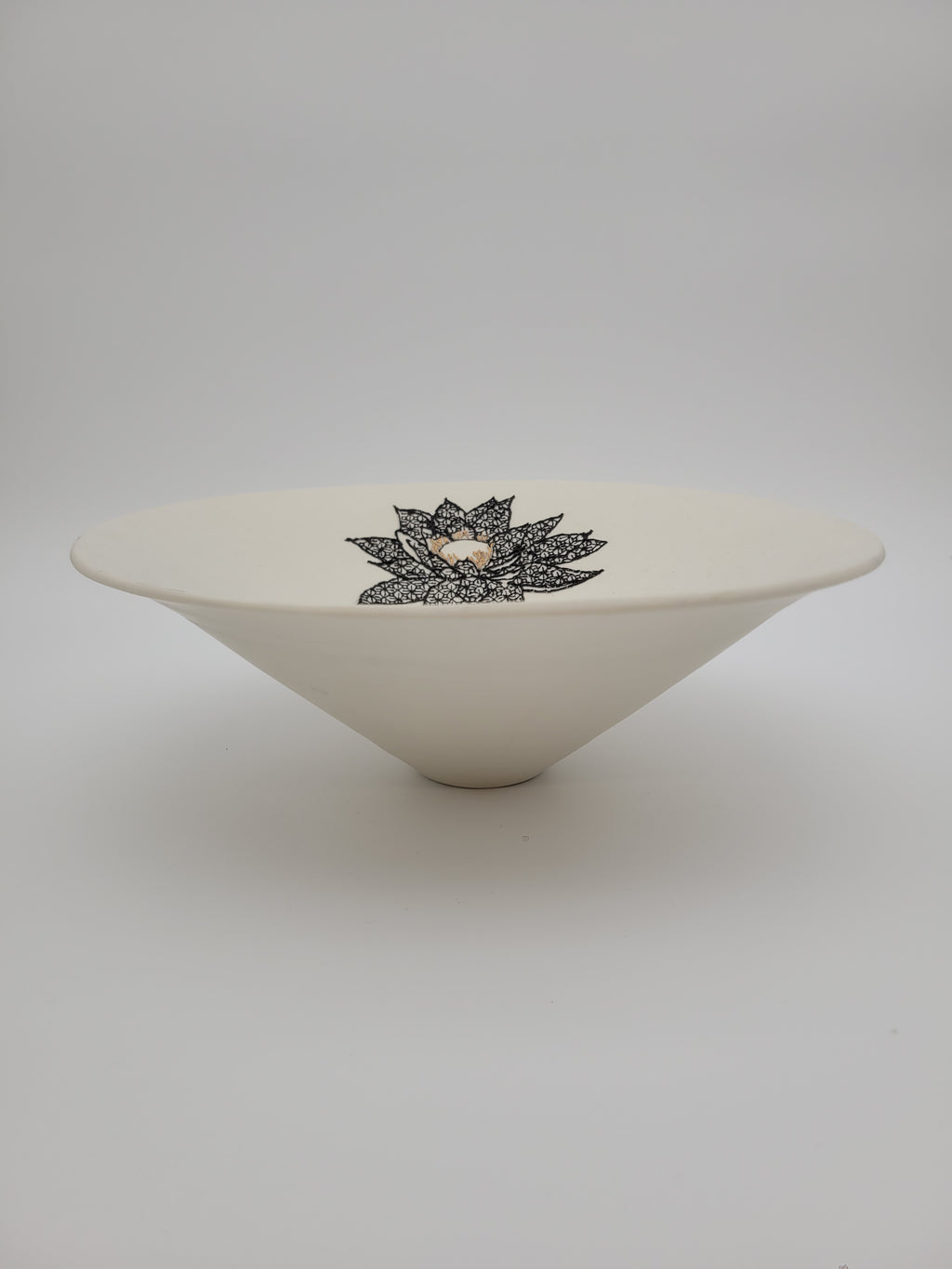 White ceramic bowl with black floral detail