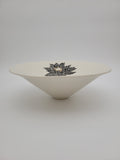 White ceramic bowl with black floral detail