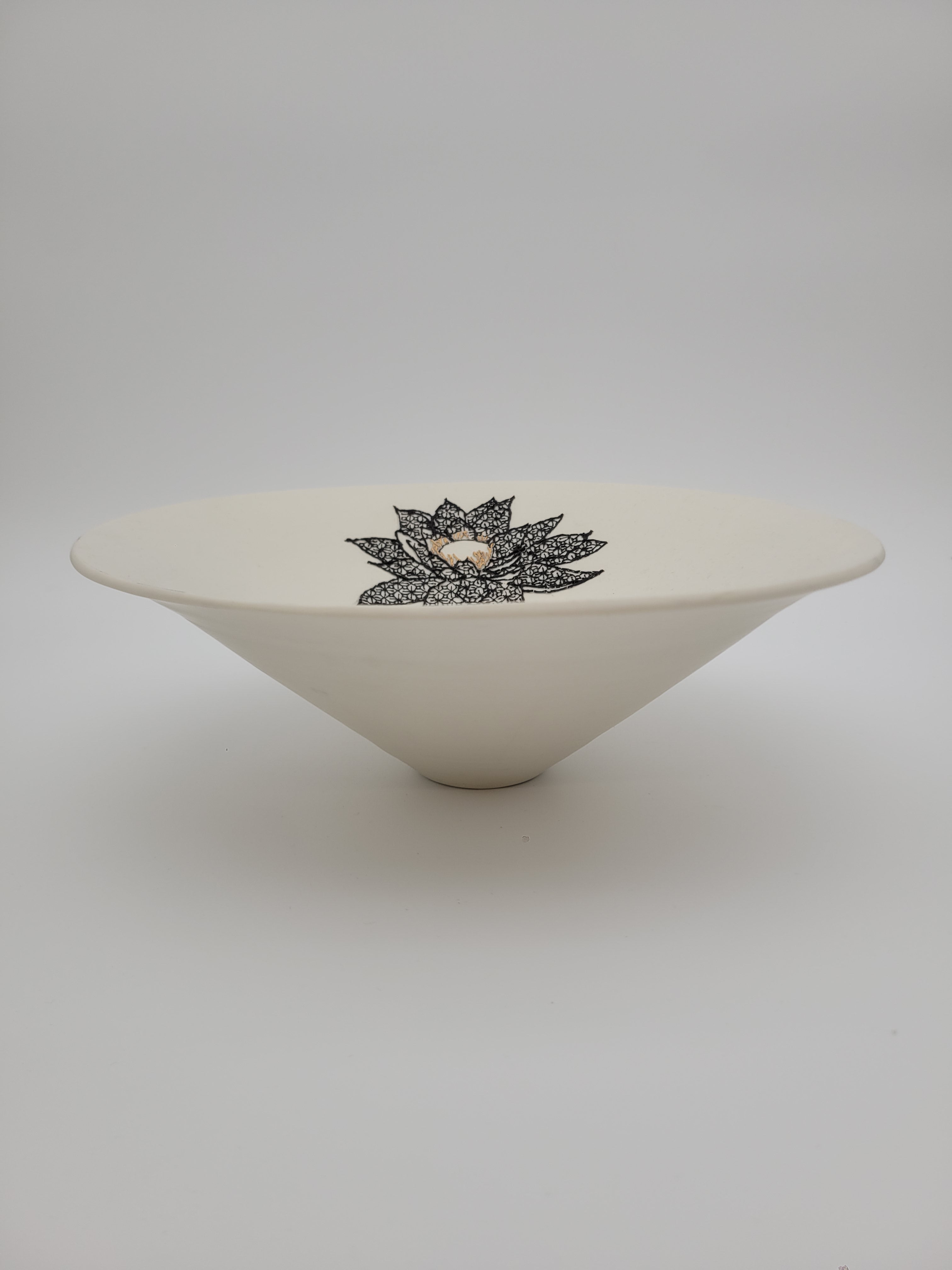 White ceramic bowl with black floral detail