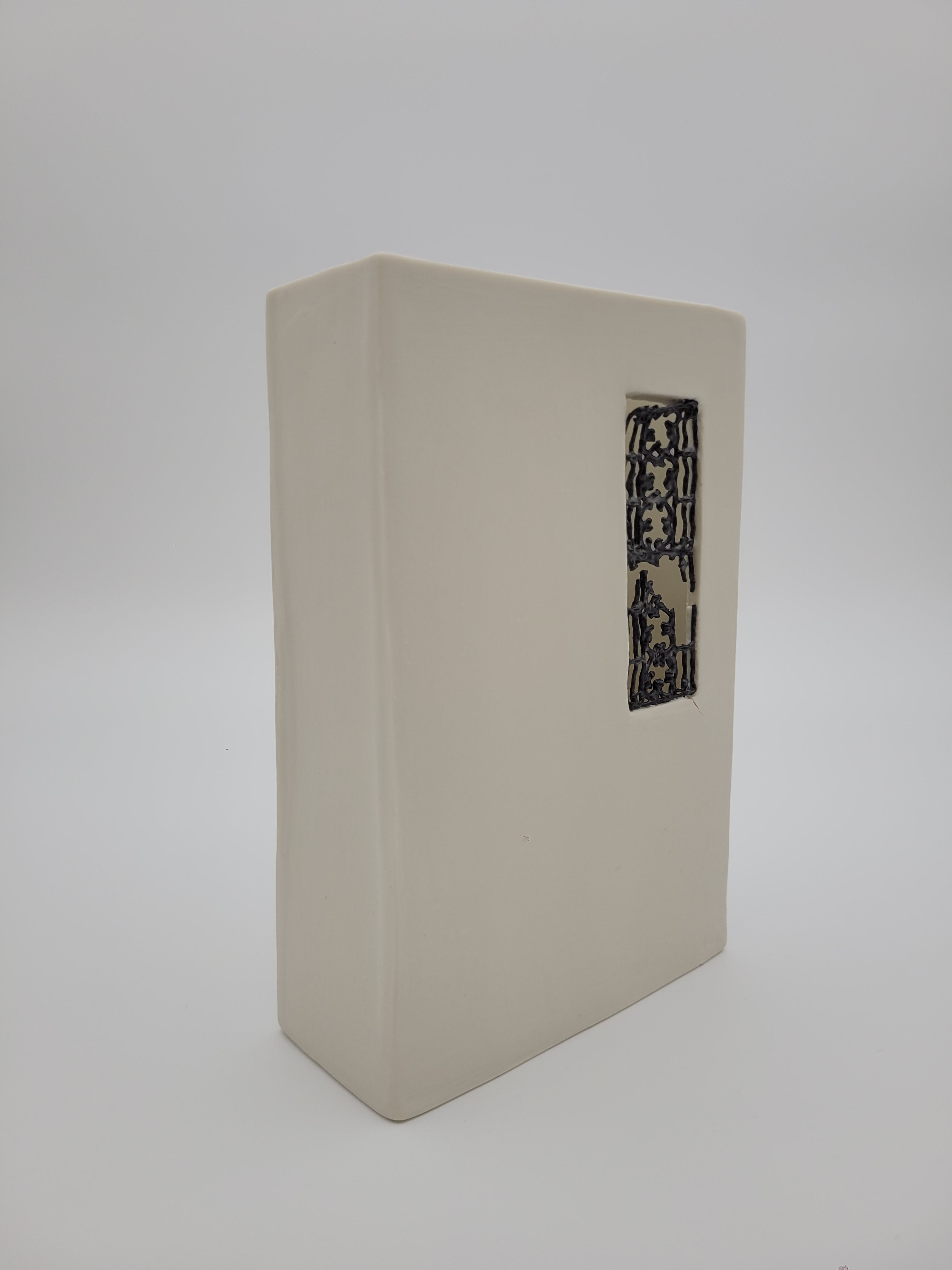 White ceramic rectangular vase with filigree detail