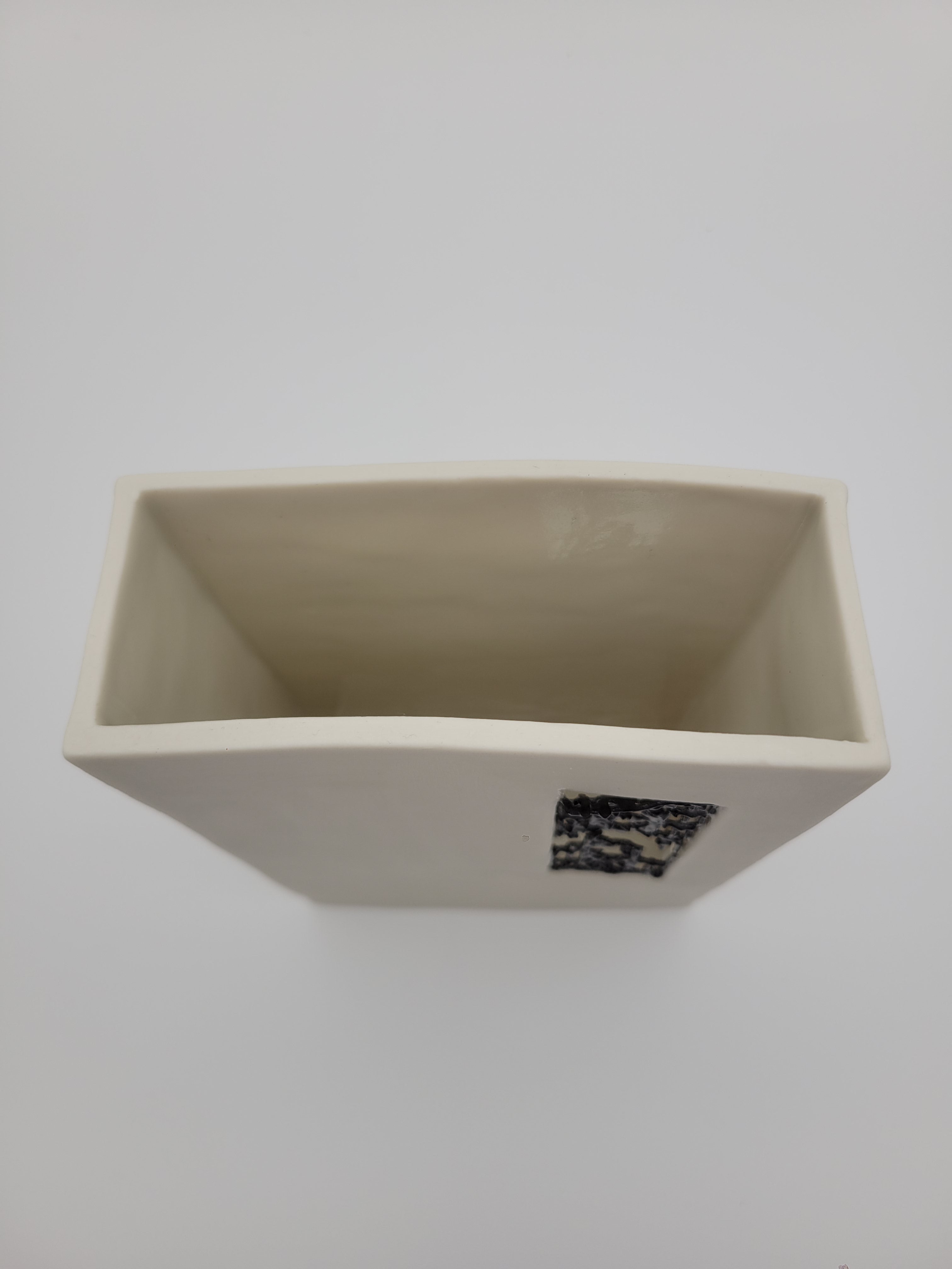 White ceramic rectangular vase with filigree detail