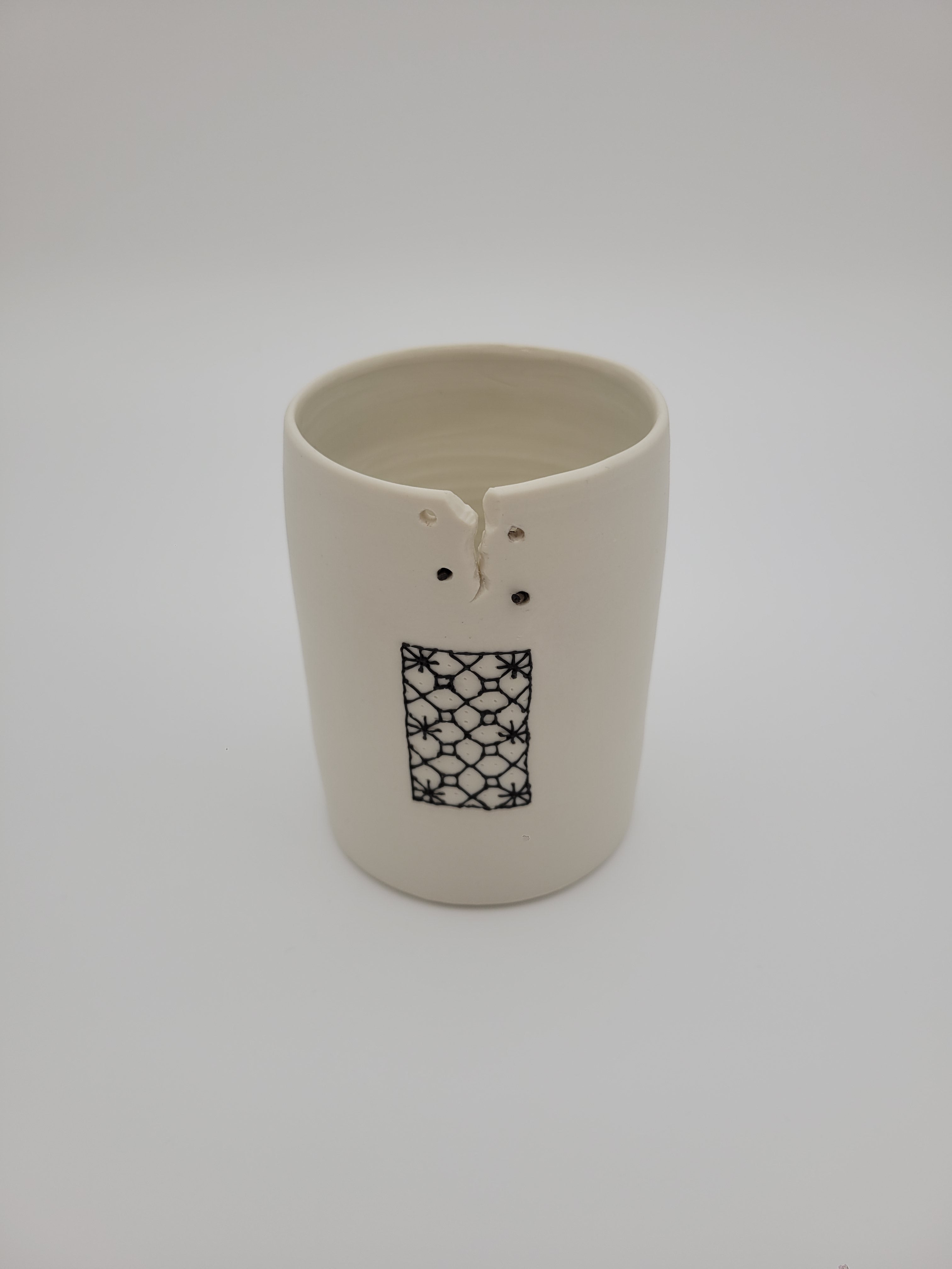 White ceramic vase - short - with filigree detail and decorative opening at rim