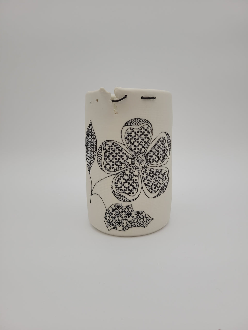 White ceramic vase - tall - with filigree detail