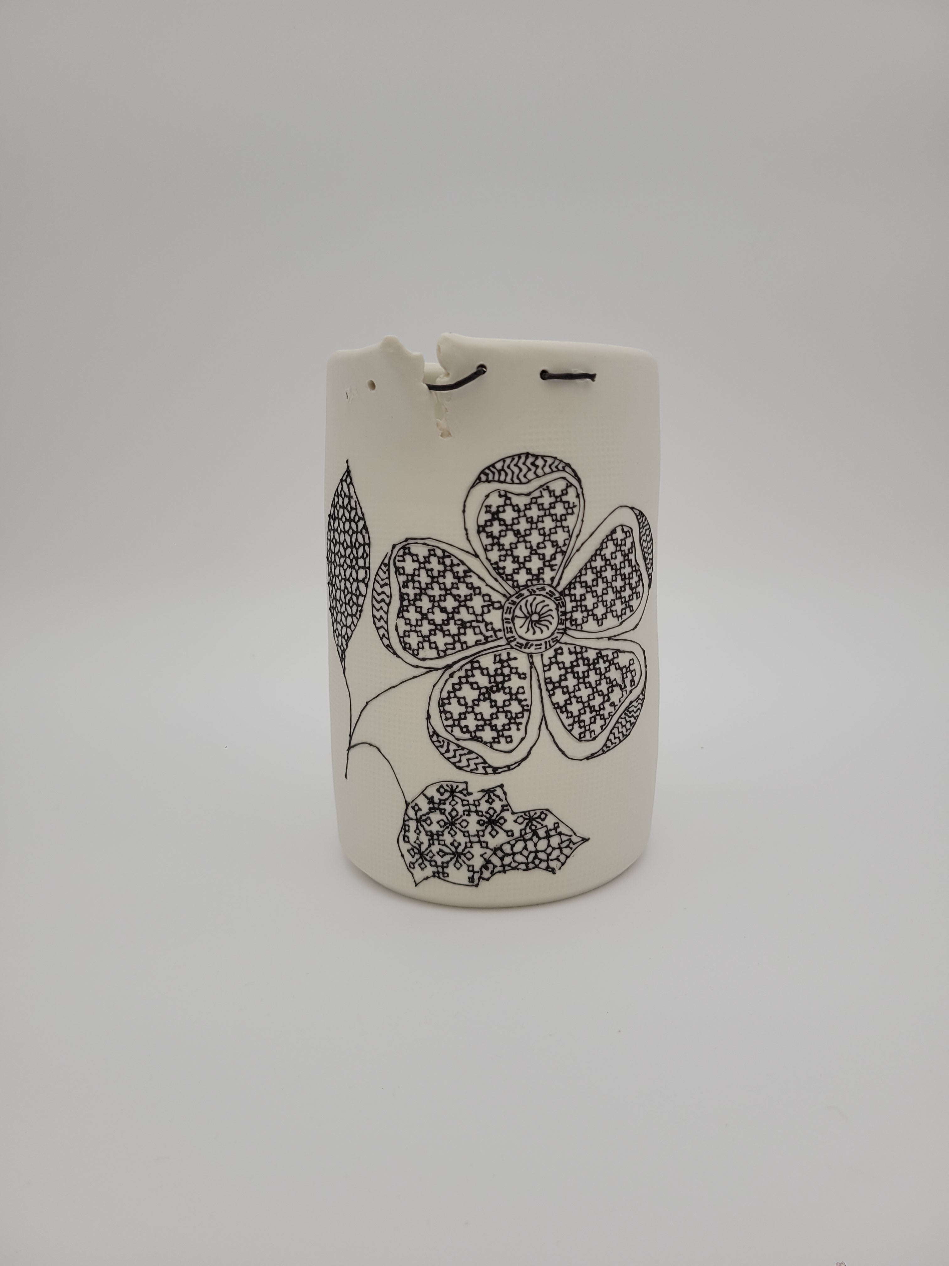 White ceramic vase - tall - with filigree detail