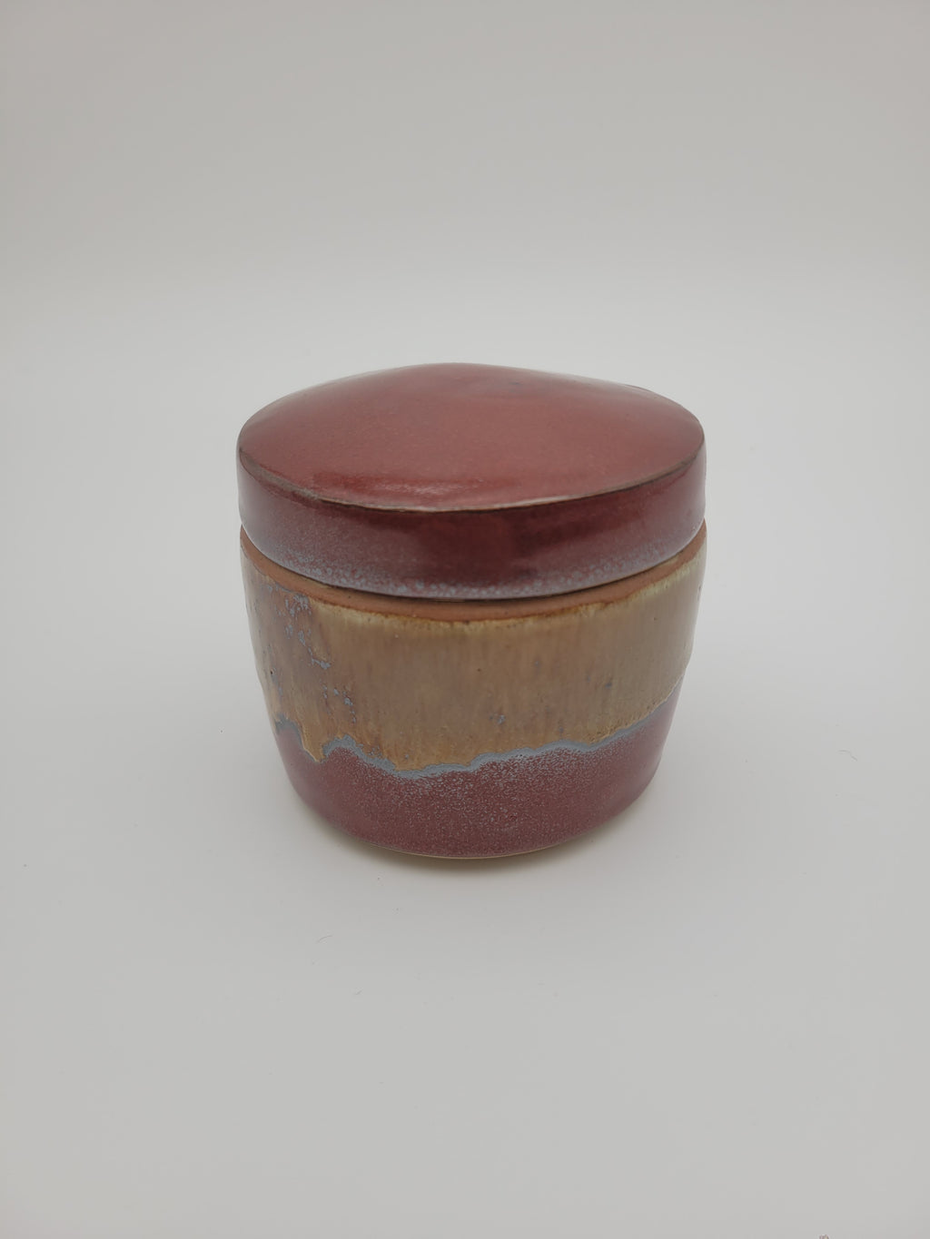 Lidded pot with brown and caramel glaze
