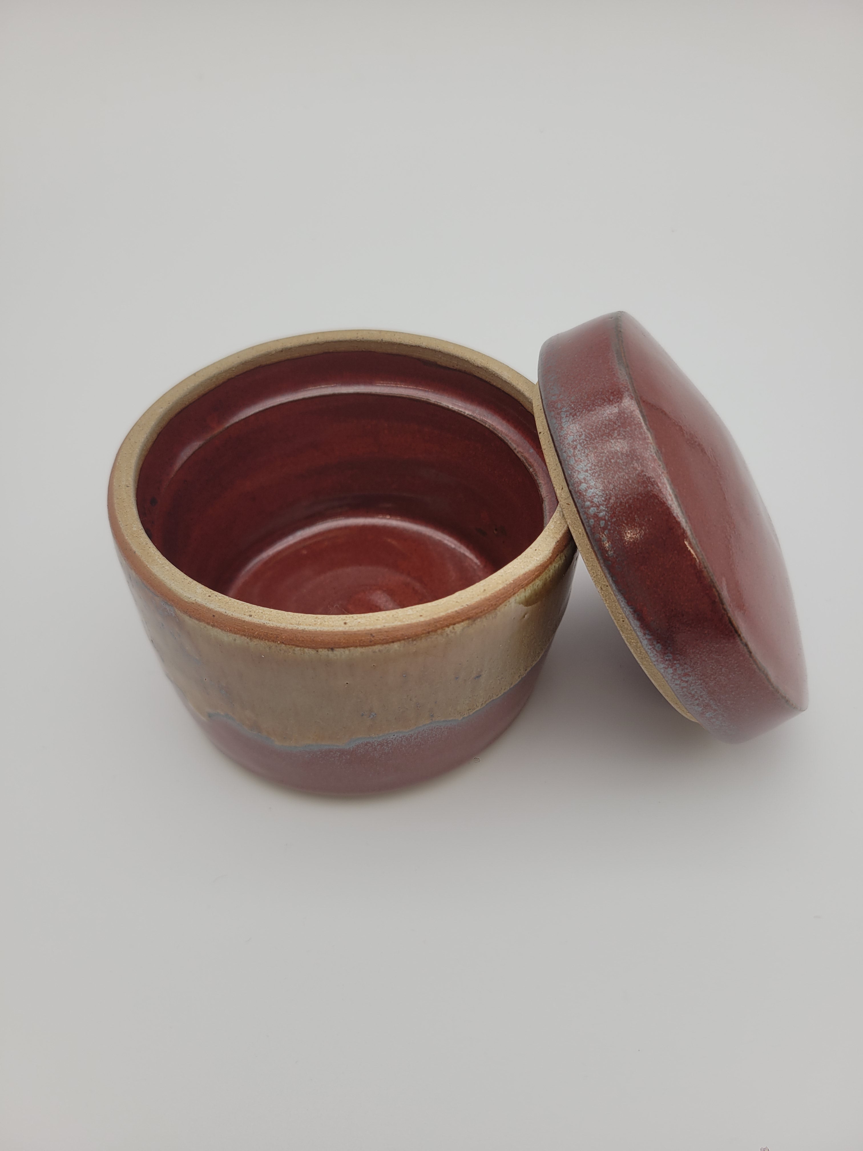 Lidded pot with brown and caramel glaze