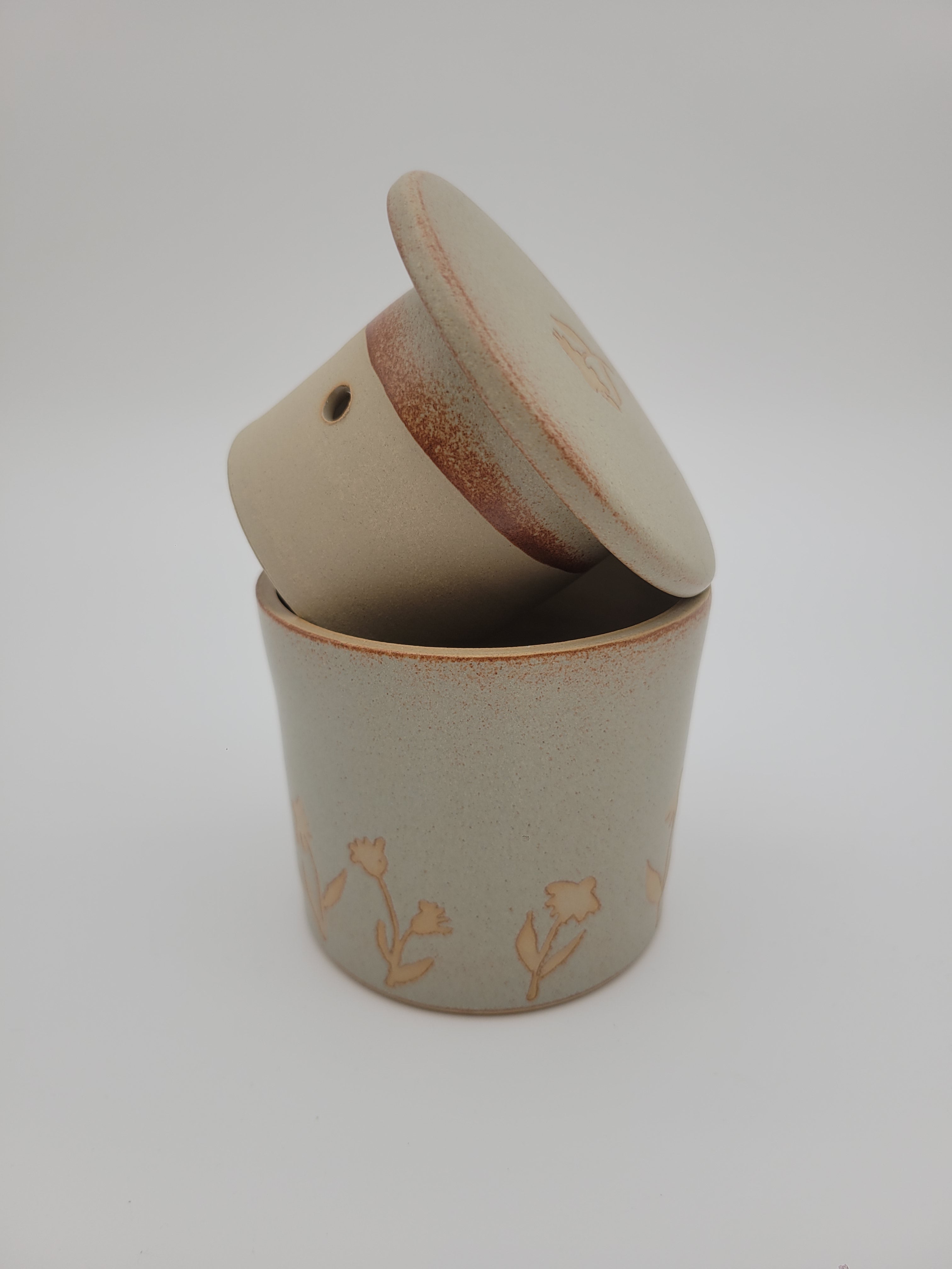 Butter crock, beige glaze with floral details at base