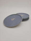 Pale blue small plates with central floral design detail