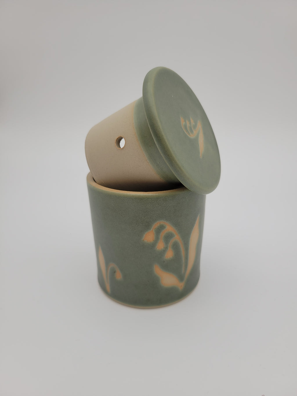 Butter crock, green glaze with floral detail