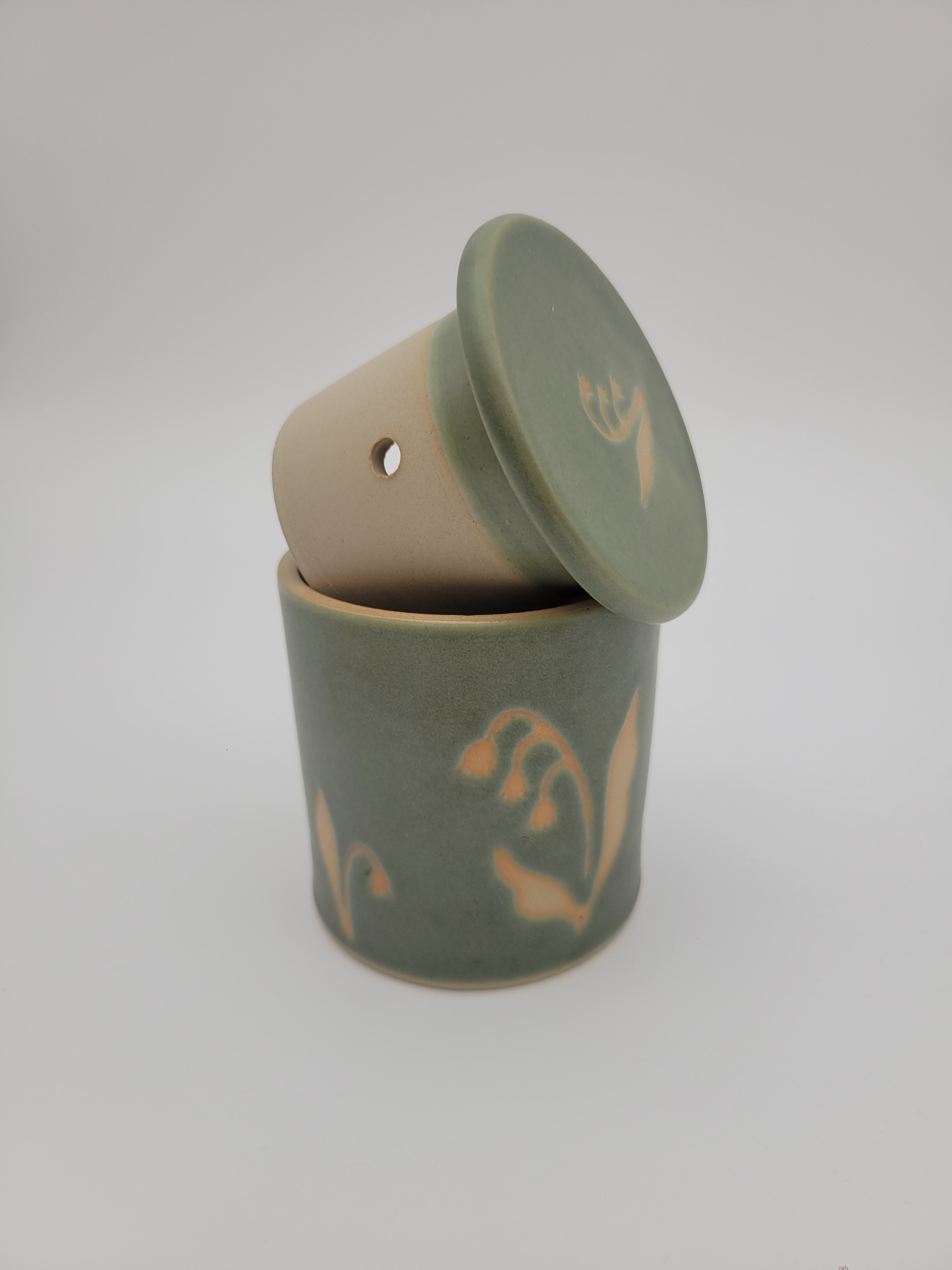 Butter crock, green glaze with floral detail