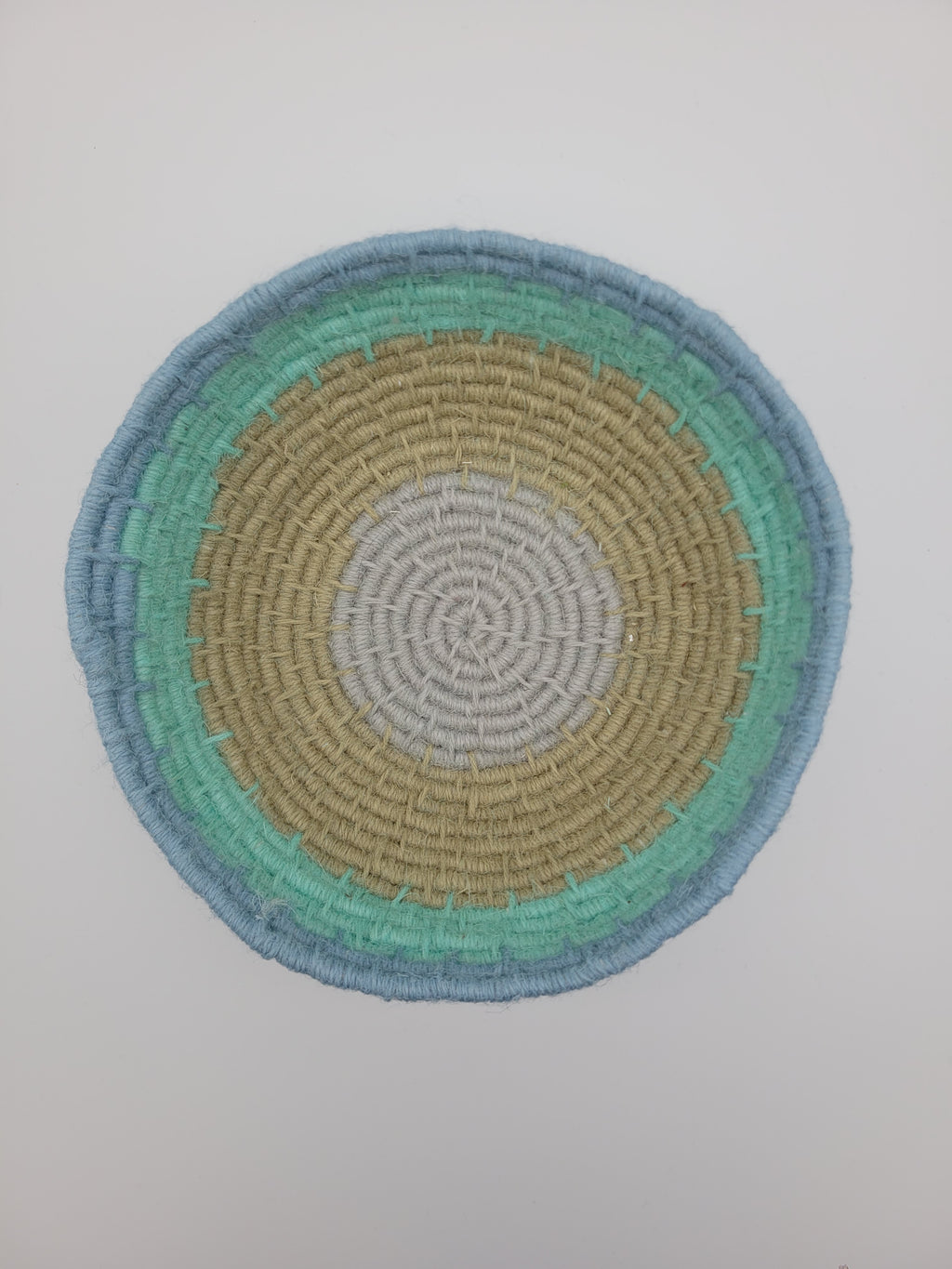 Handmade coiled yarn bowl in natural and sea foam colours