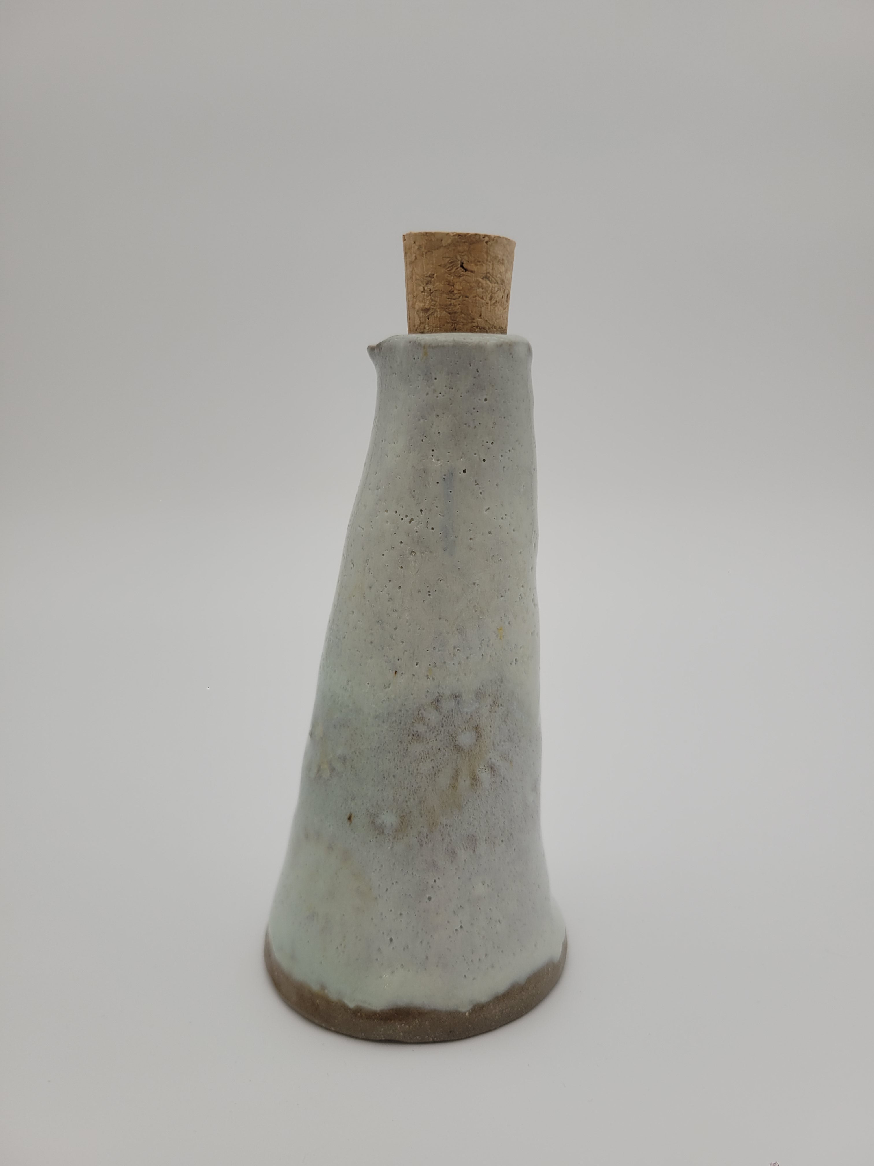 Bottle for oil or vinegar with white glaze half floral design.