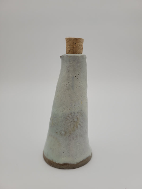 Bottle for oil or vinegar with white glaze half floral design.