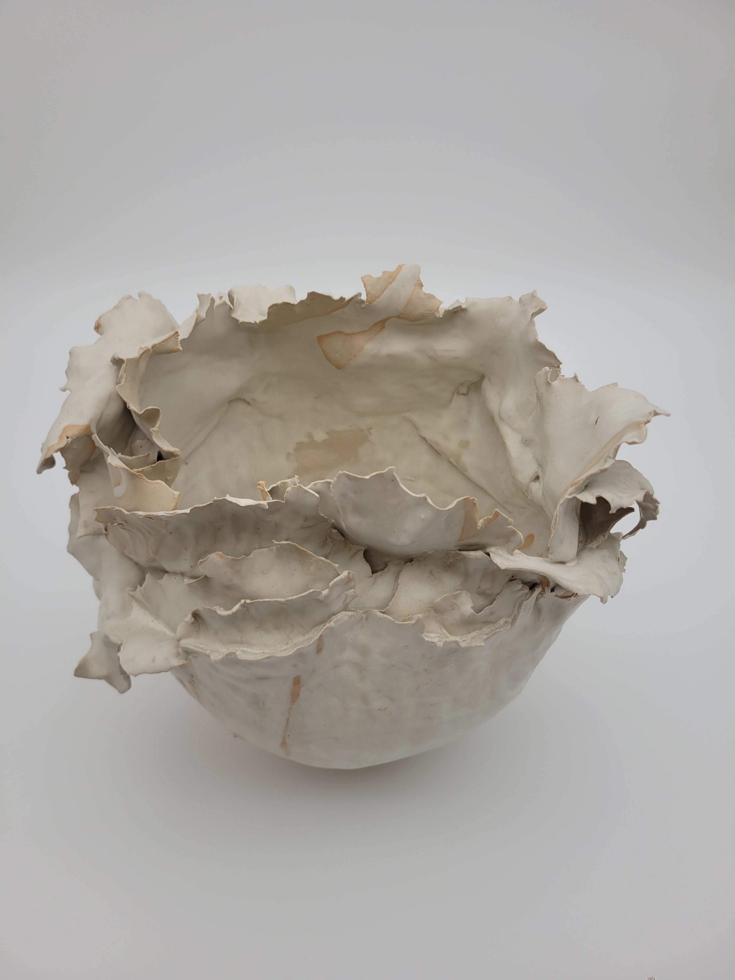Hand crafted ceramic vase with frilled construction