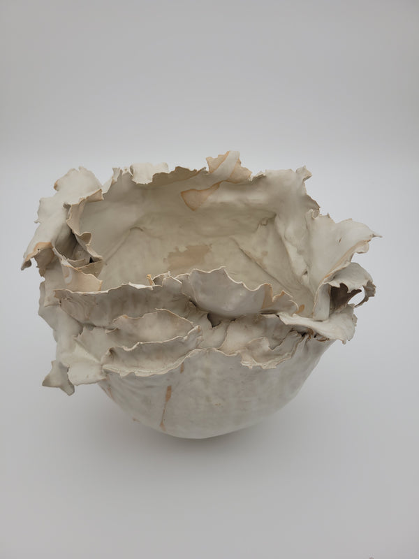 Hand crafted ceramic vase with frilled construction