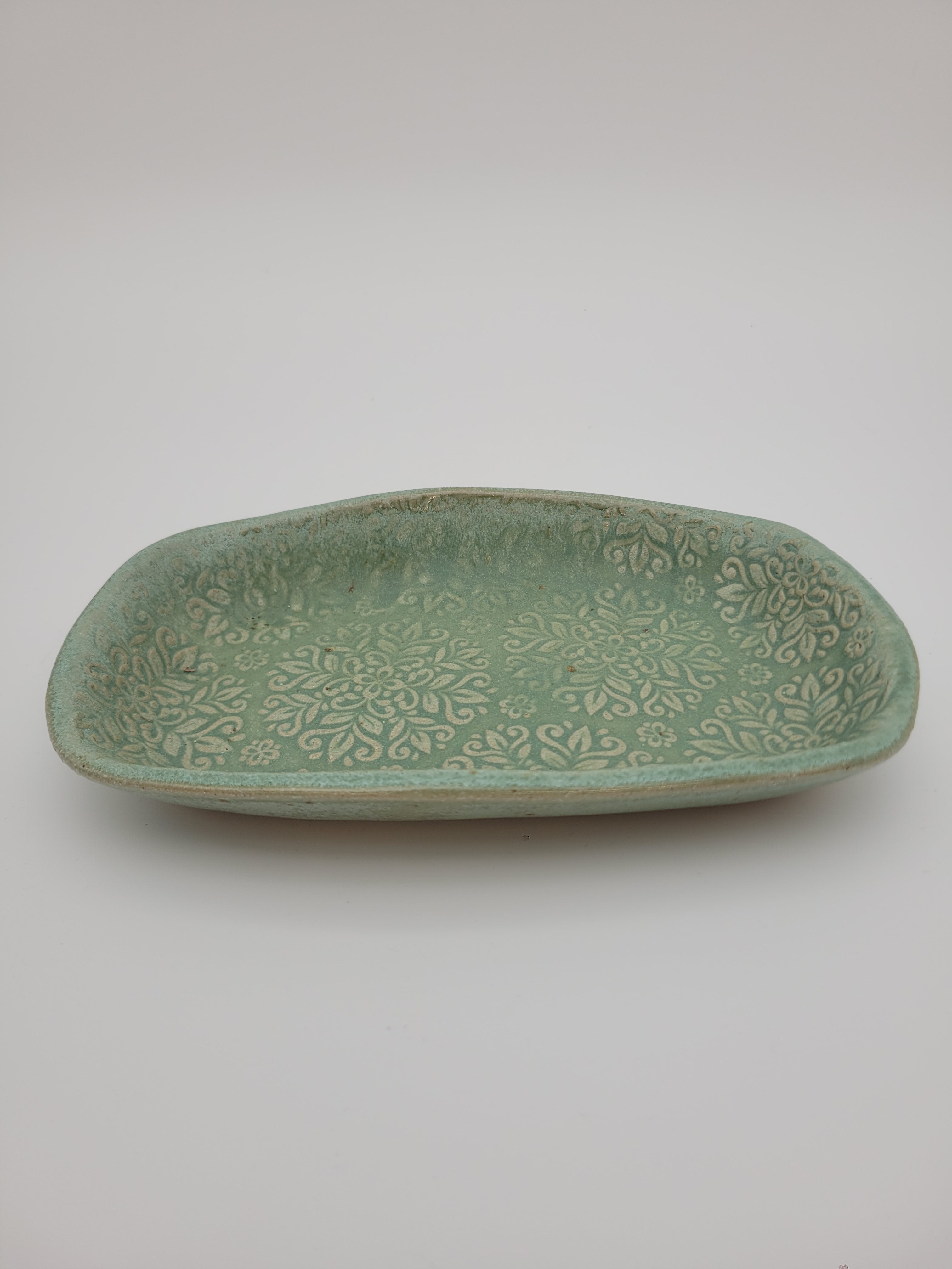 Trinket dish, pale green, with embossed open floral design