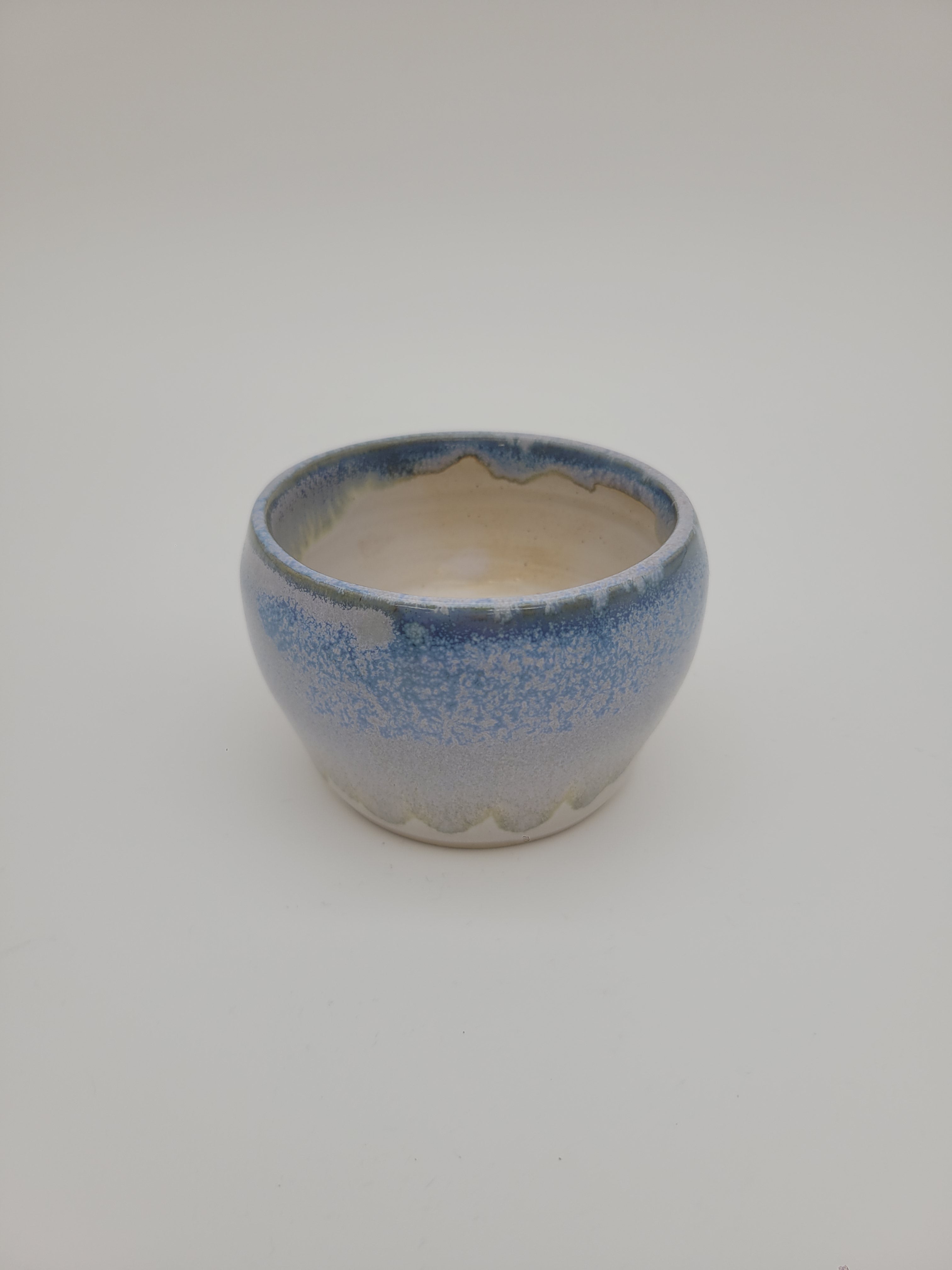 Small rounded bowl with blue glaze detail