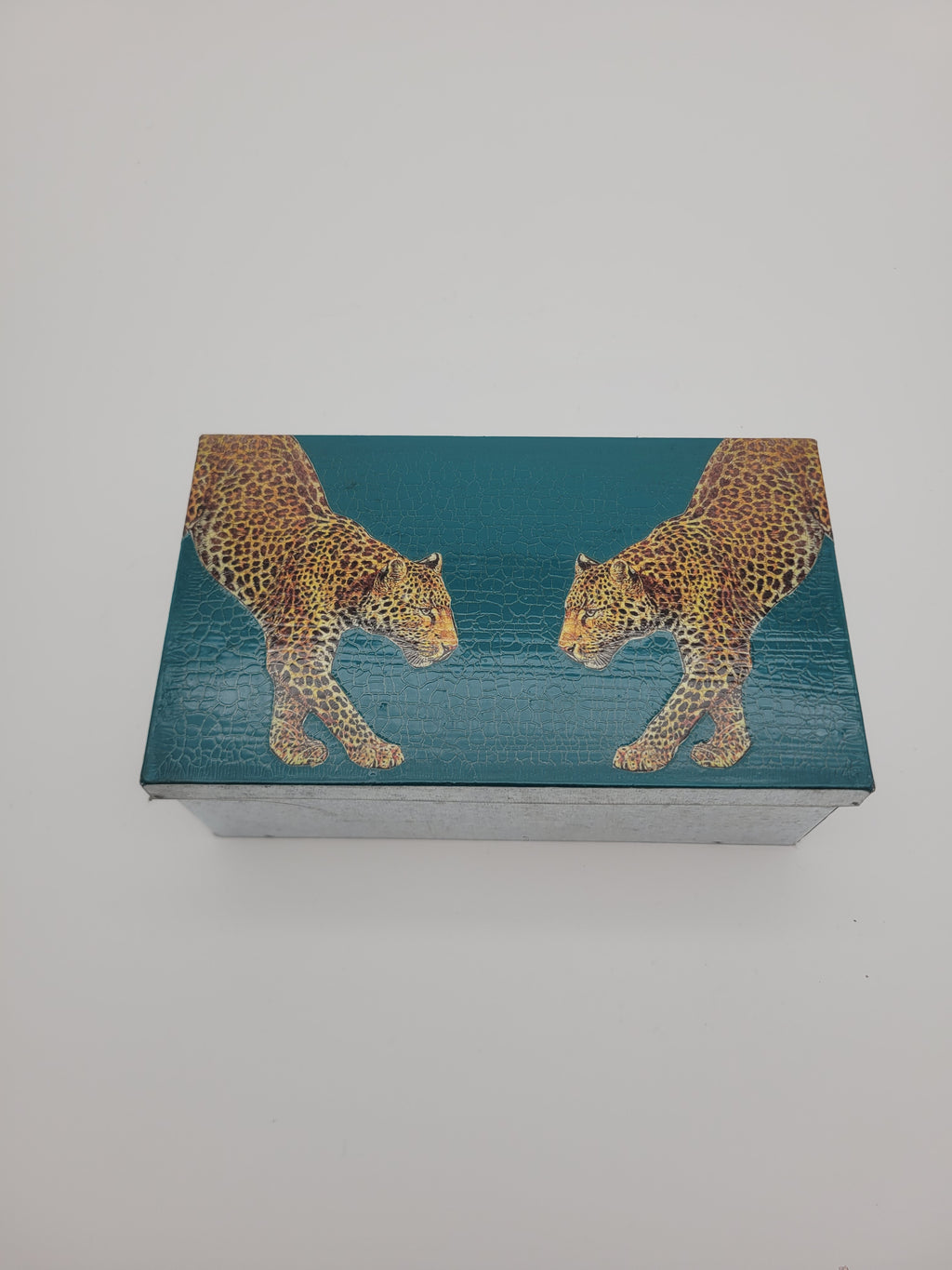 Decoupage tin with two leopards