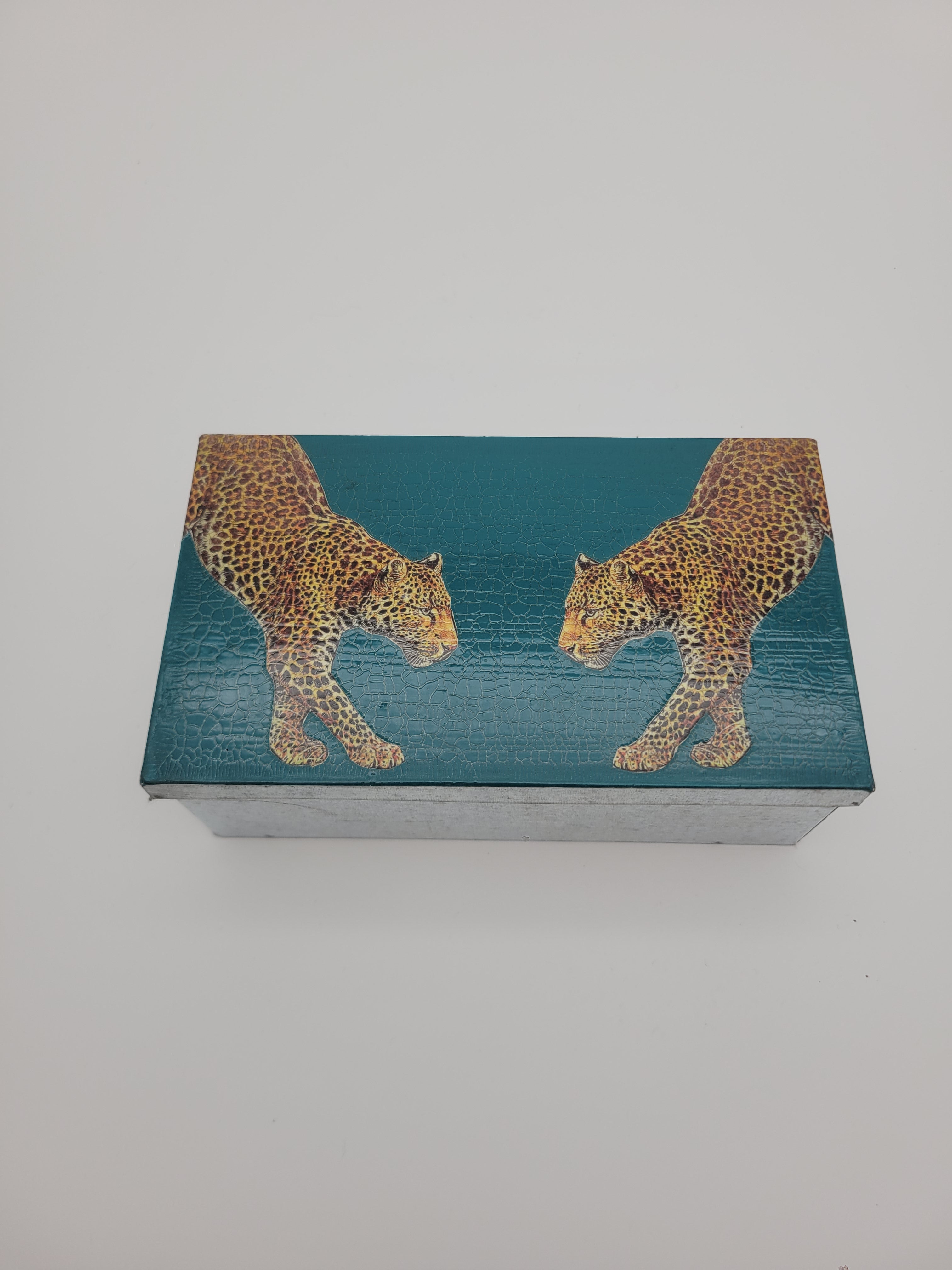 Decoupage tin with two leopards