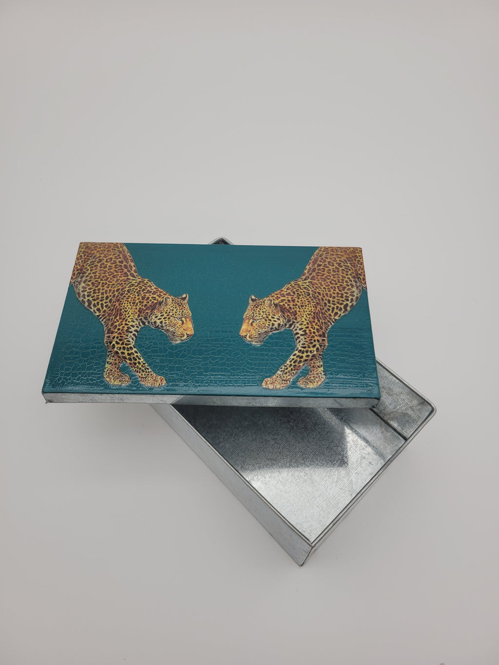 Decoupage tin with two leopards