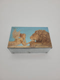 Decoupage tin with lion and angel design