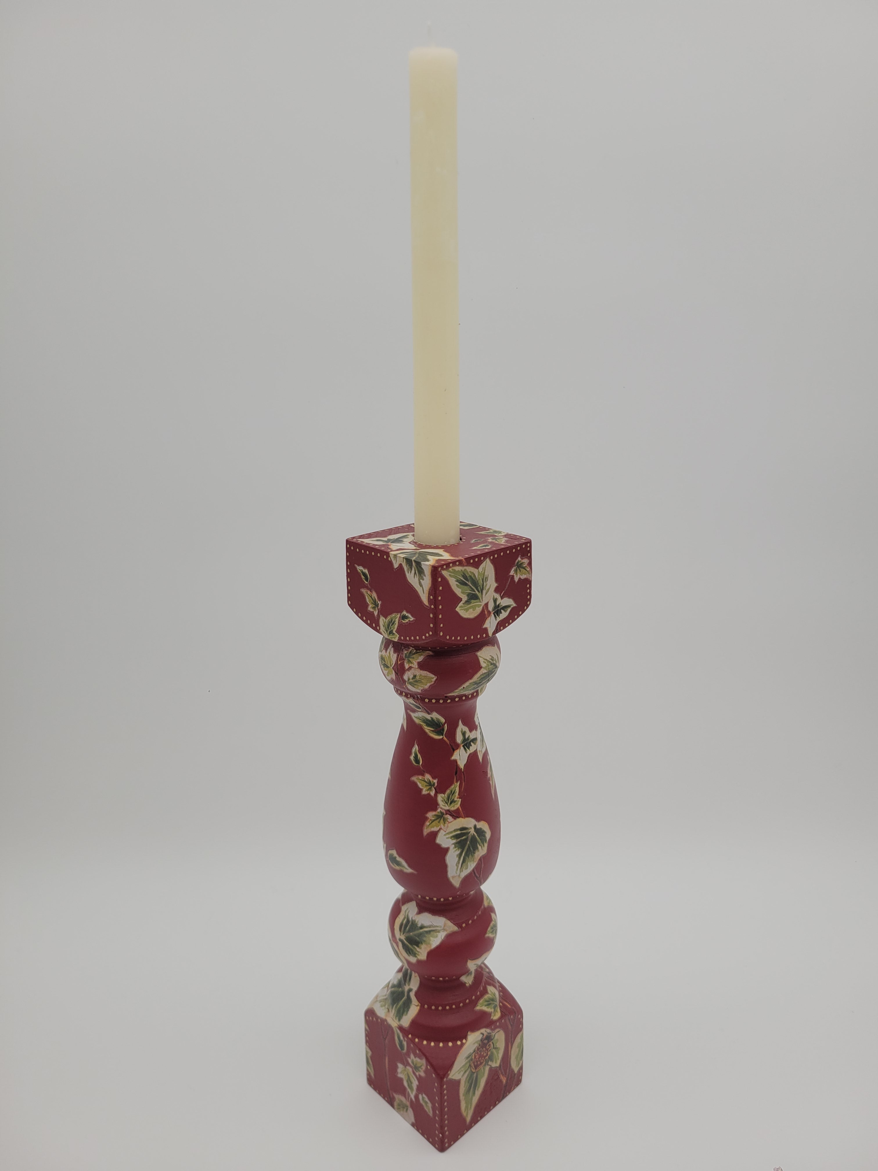 Decoupaged candlestick - ivy on red background