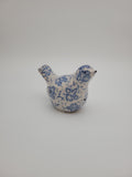 Small decorative bird with blue and white design