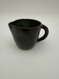 Jug in green/brown glaze
