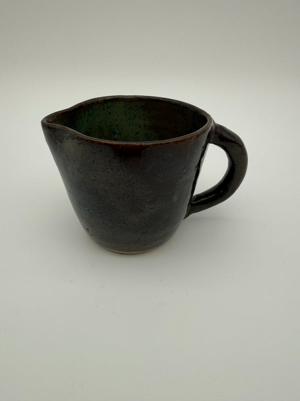 Jug in green/brown glaze