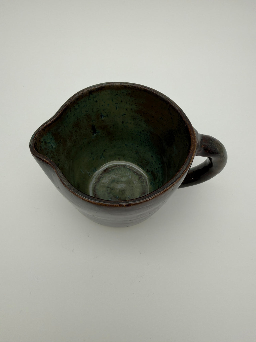 Jug in green/brown glaze