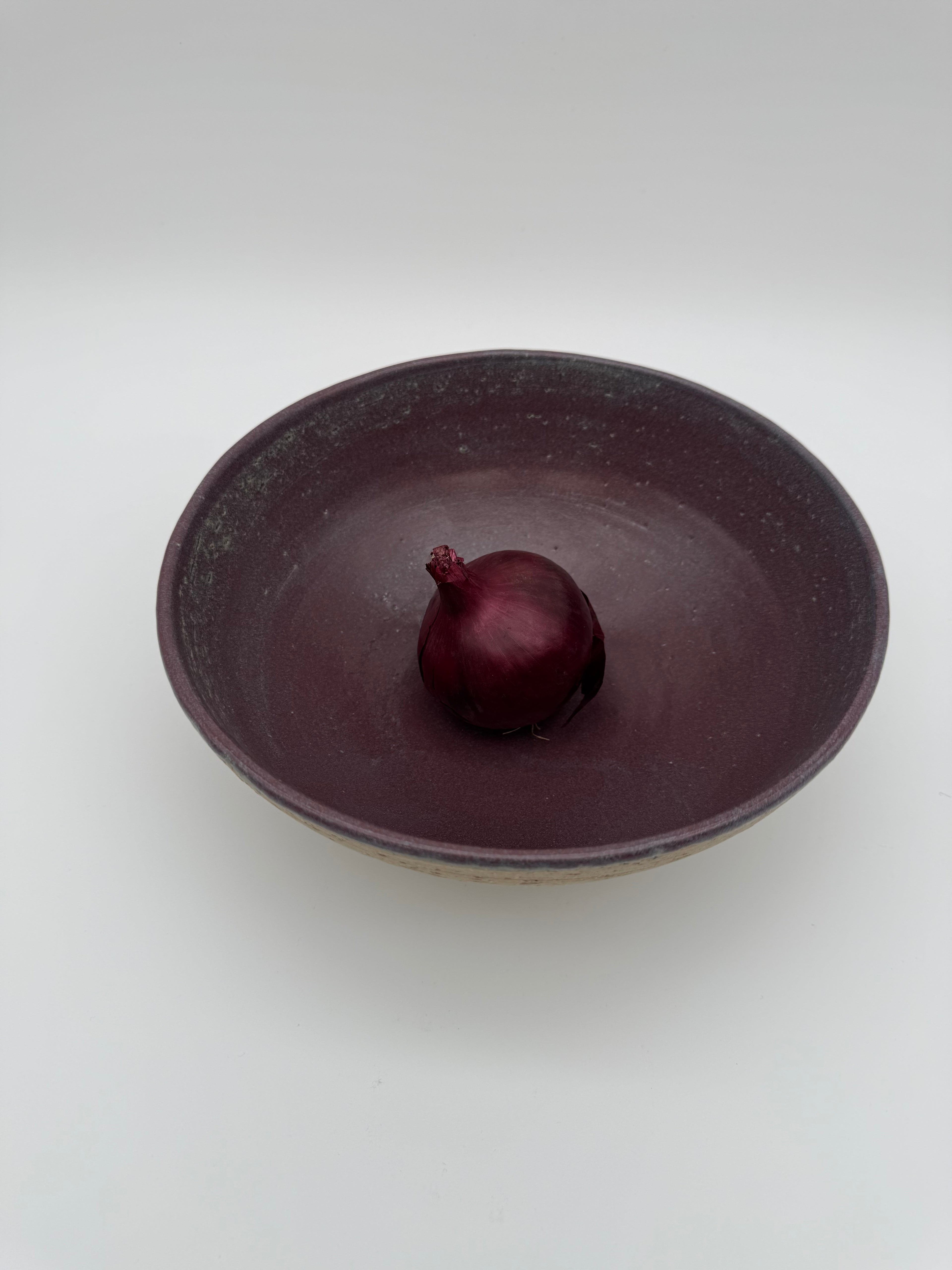 Bowl with aubergine colour interior glaze