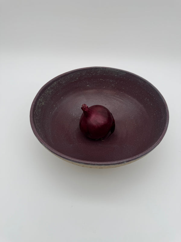 Bowl with aubergine colour interior glaze