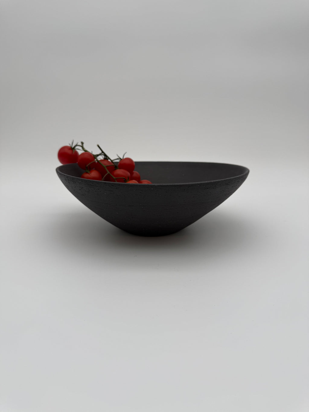 Bowl with angled profile in dark grey
