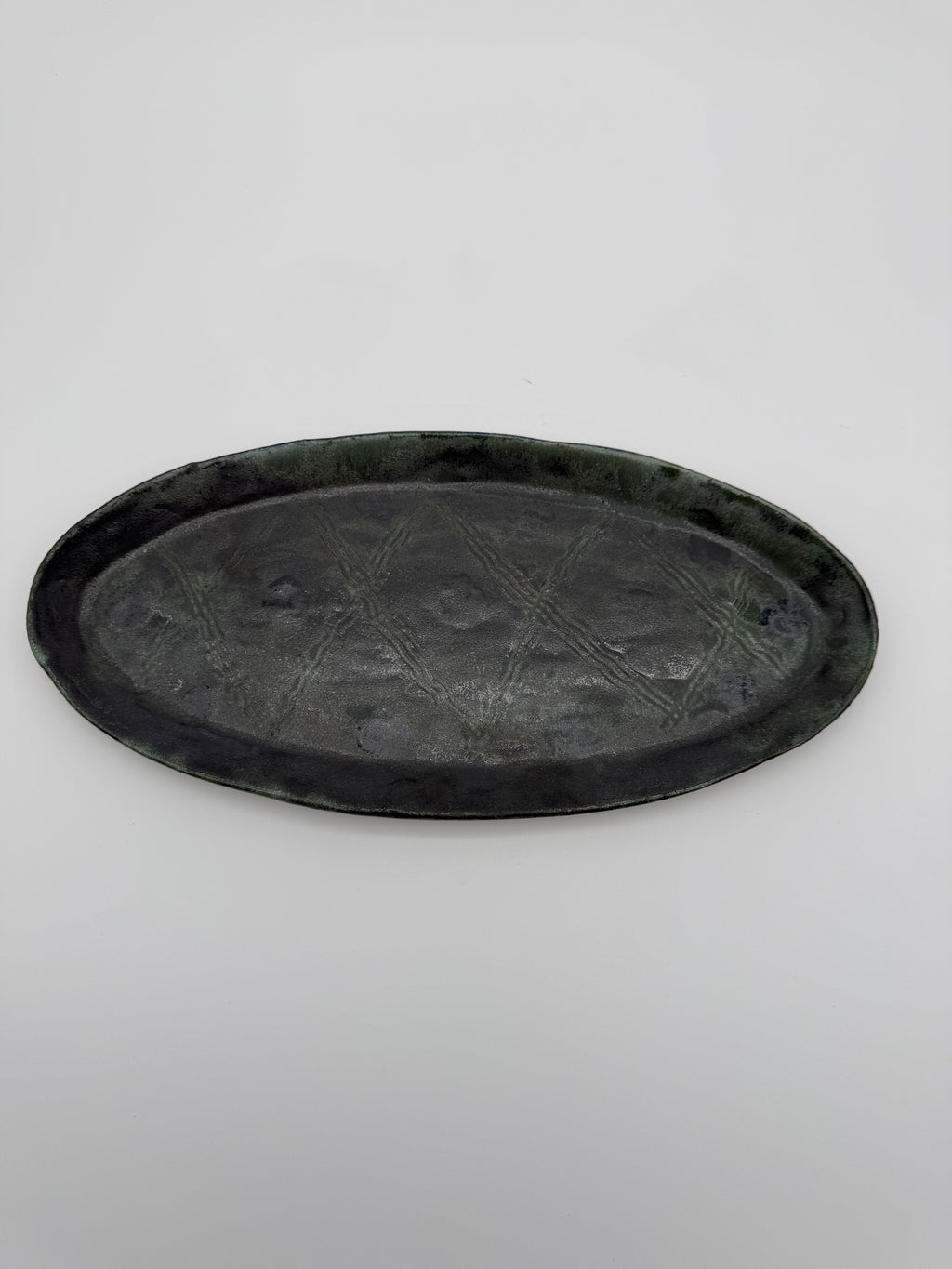 Ceramic platter with imprinted design
