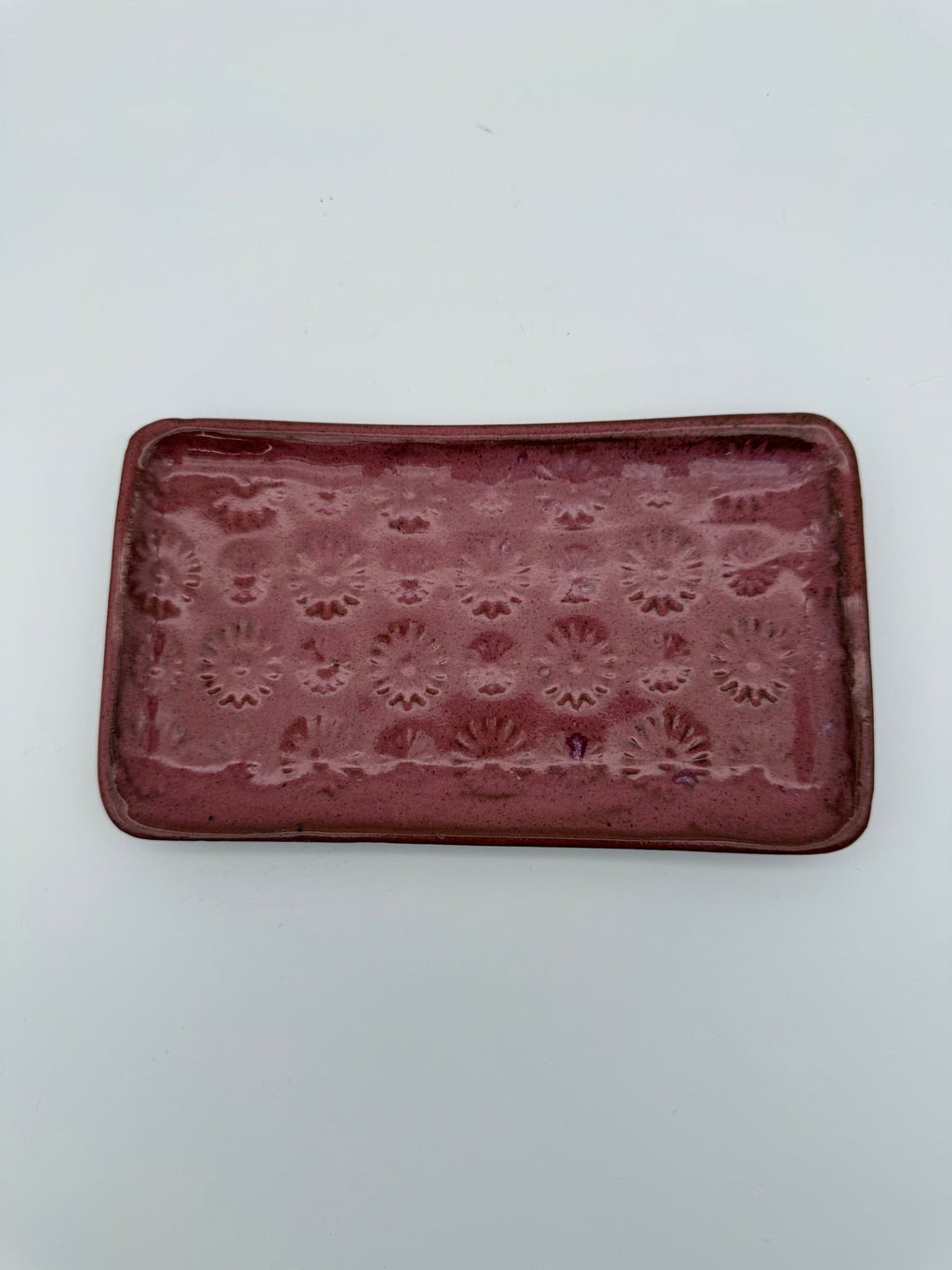 Platter with embossed design.