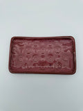 Platter with embossed design.