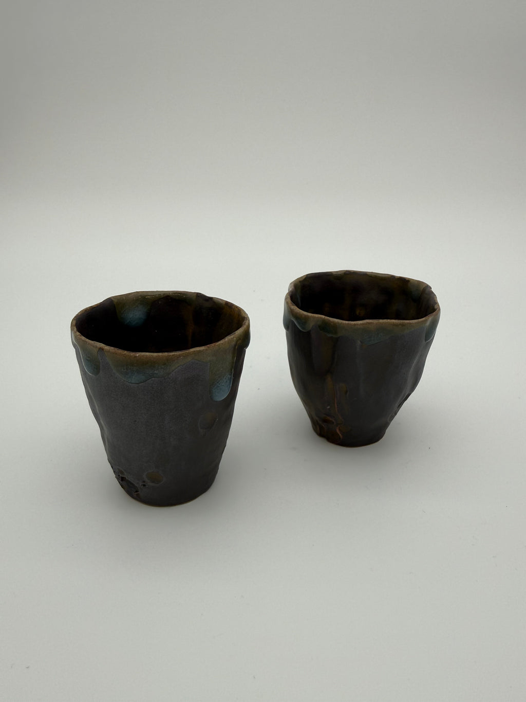 Sake cups - hand pinched with blue drip glaze detail