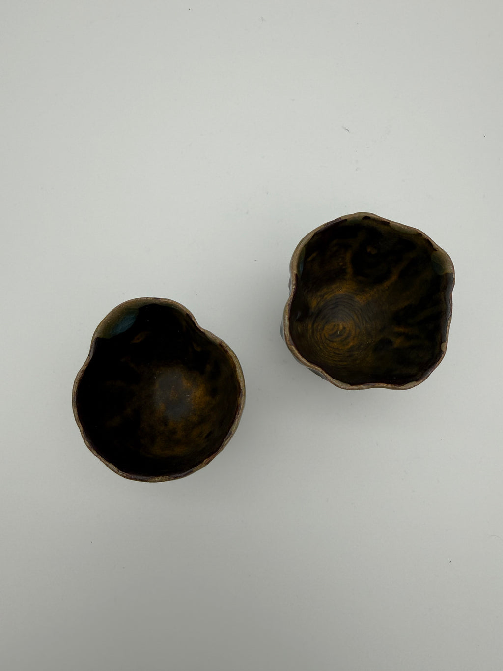 Sake cups - hand pinched with blue drip glaze detail