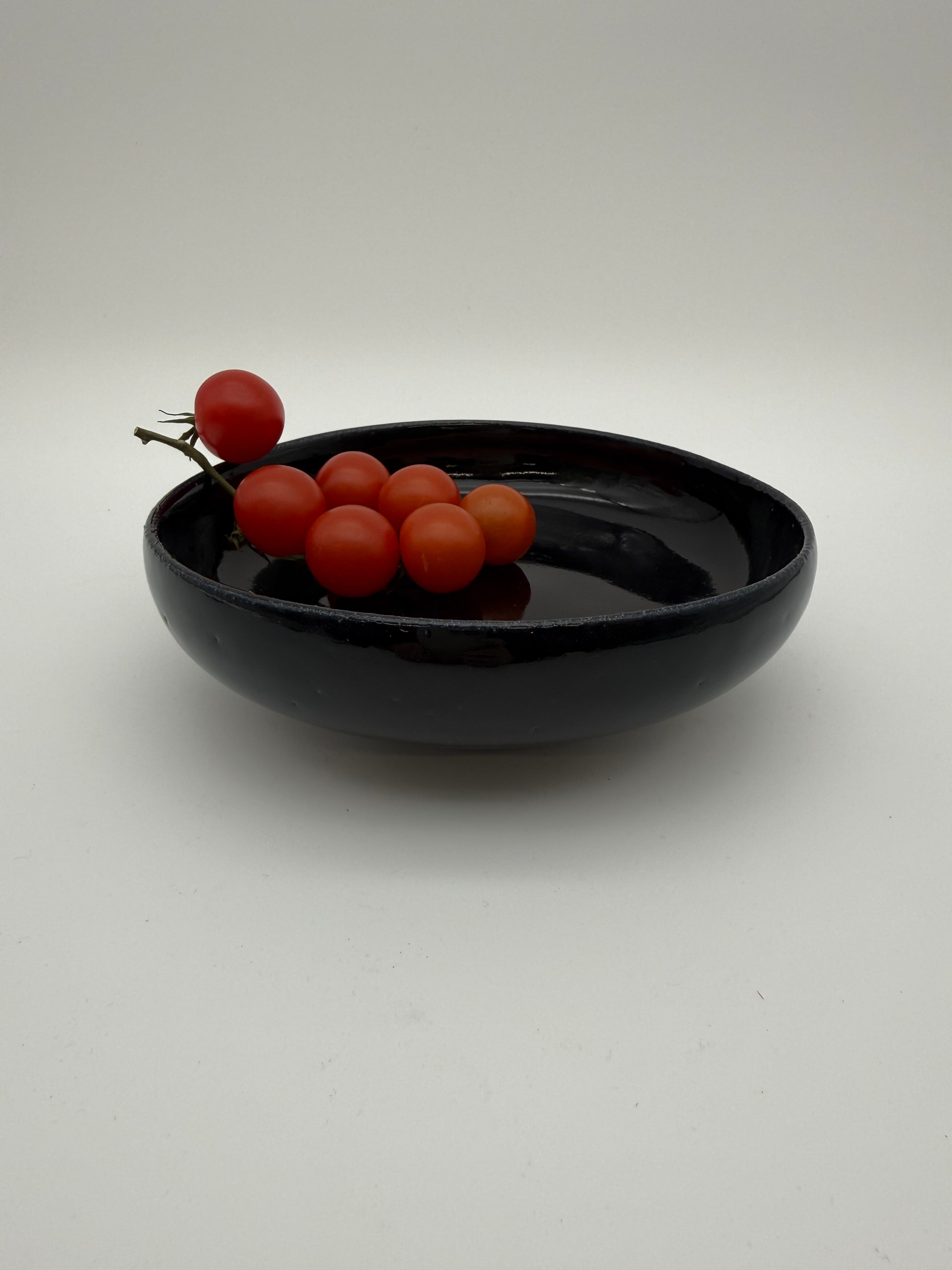 Bowl, black glaze, with small pedestal foot