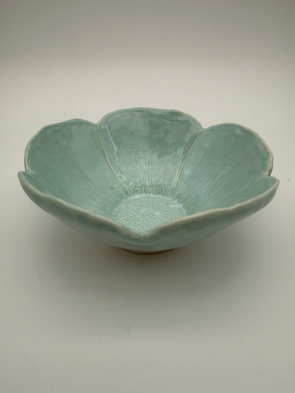 Bowl, petal design, in pale green glaze
