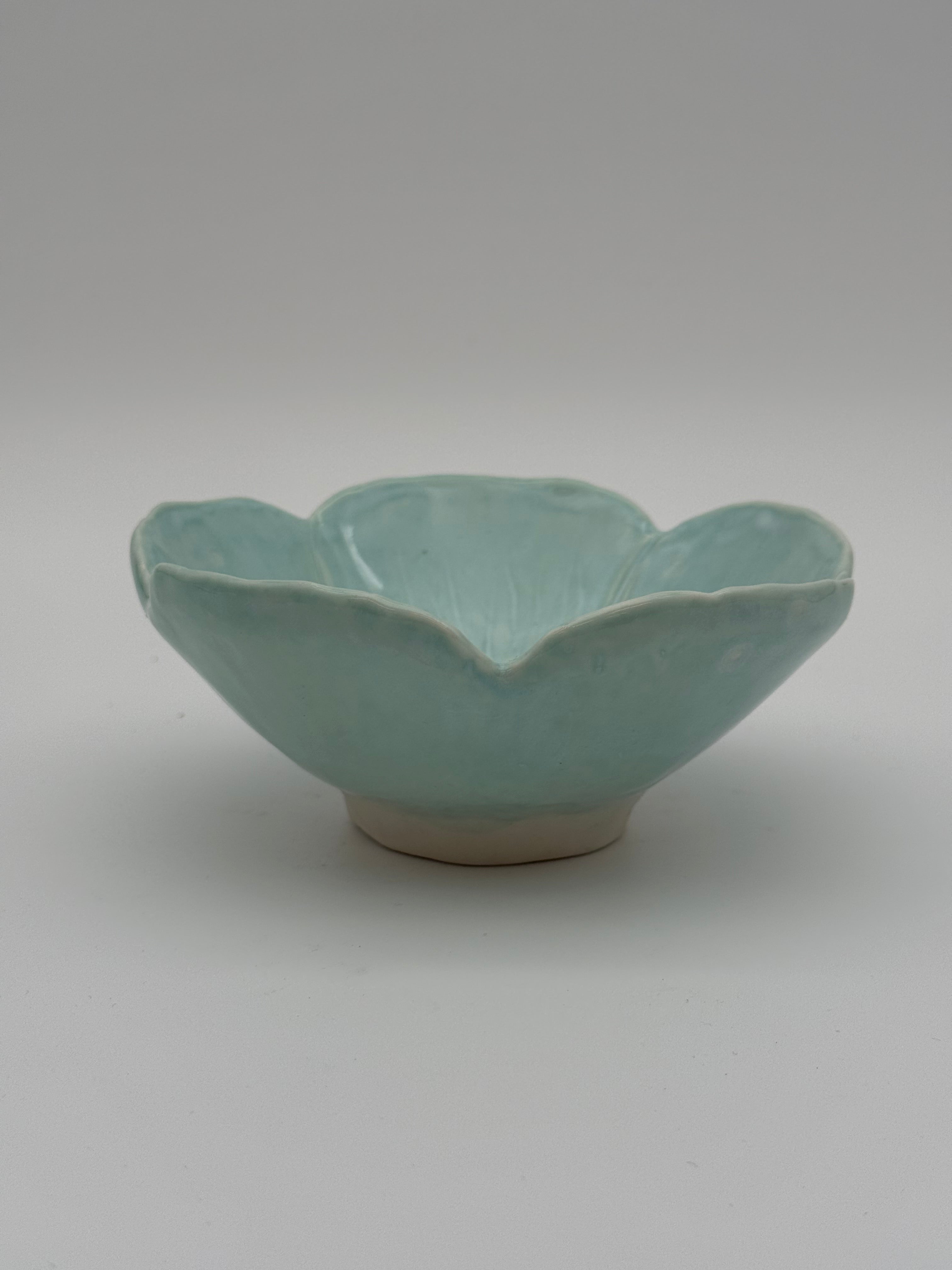 Bowl, petal design, in pale green glaze