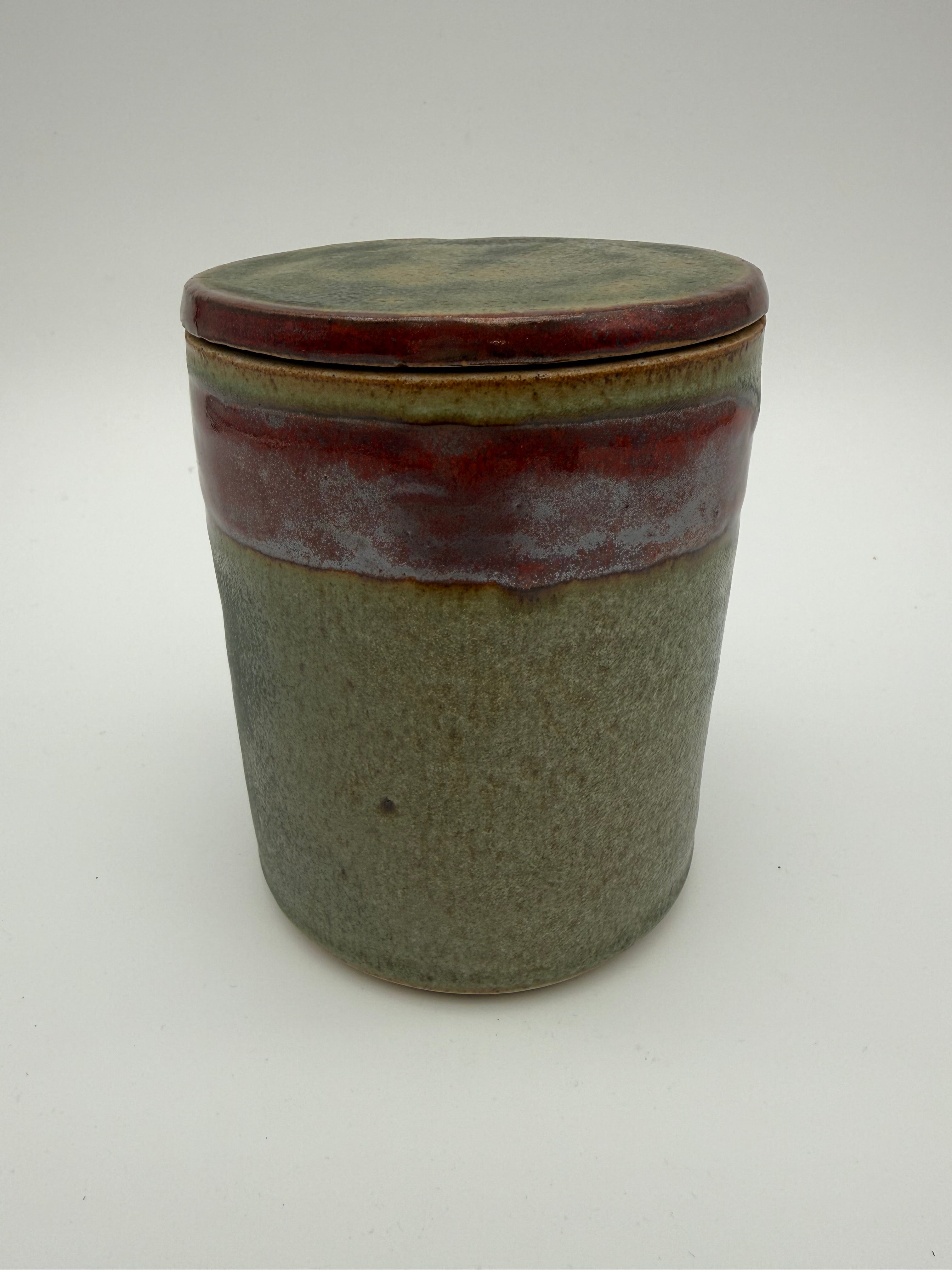 Lidded pots with green and brown glaze